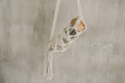 Reusable Glass Drinking Vessel Inside A Macrame Hanging Holder