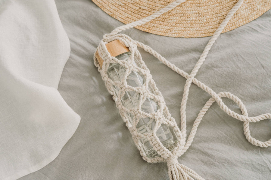 Reusable Glass Drinking Vessel Within A Macrame Holder